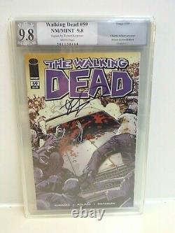 Walking Dead #59 9.8 Near Mint/ Mint graded by PGX, Signed by Robert Kirkman