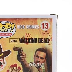 Funko Pop The Walking Dead Bloody Rick Grimes Harrison's Comics Exclusive #13  <br/>
	 
   <br/>Funko Pop Le Walking Dead Bloody Rick Grimes Harrison's Comics Exclusive #13