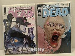 Lot 57 Walking Dead Comics #1100, 117-118,129-133,141-146,148-150,155-160,162+